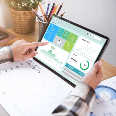 Blog cover photo of a CRM software dashboard on a laptop, highlighting the benefits for the solar industry.