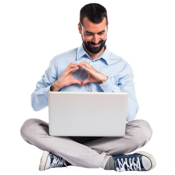 A happy man with a laptop, reflecting the success of Google Workspace Consulting services in Australia.